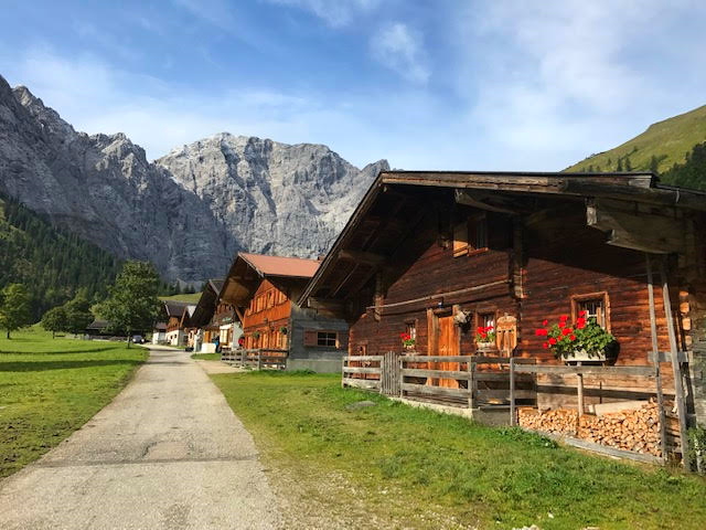 Wooden Chalets with colour flower window boxes in Eng a charming village passed in the Karwendel Mountains