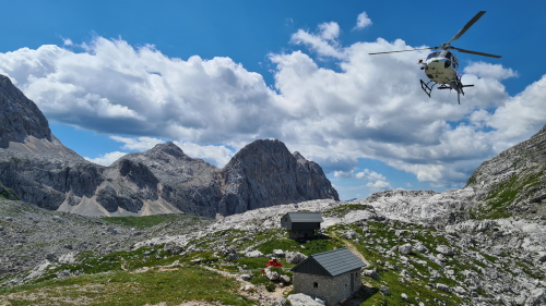 helipcopter approaching a hut in the Triglav National Park